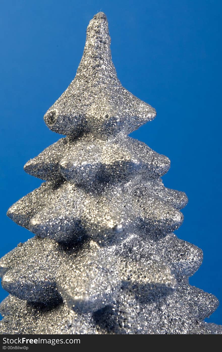 Silver sparkly christmas tree top detail. Silver sparkly christmas tree top detail