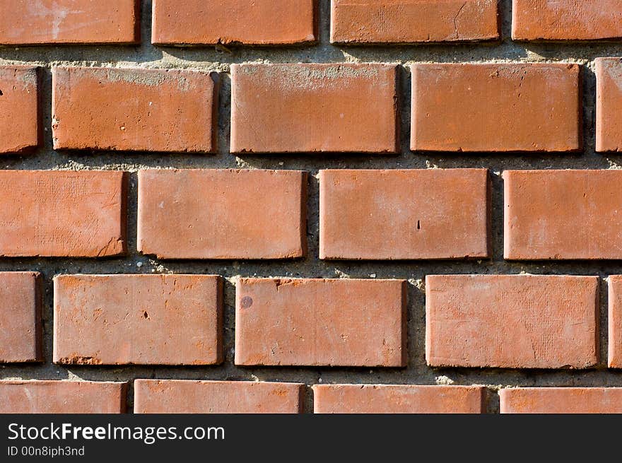 Reddish-brownish colored brick wall texture