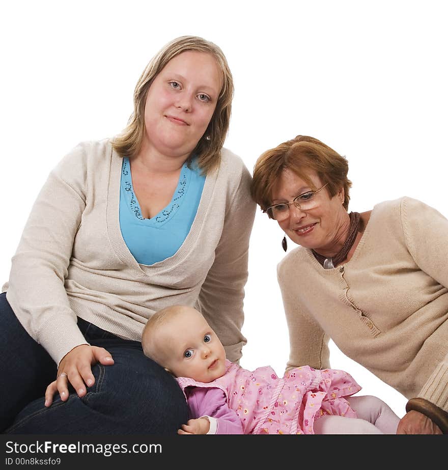 Three generation picture with a baby her mother and her great-grandma sitting on the bottom. Three generation picture with a baby her mother and her great-grandma sitting on the bottom