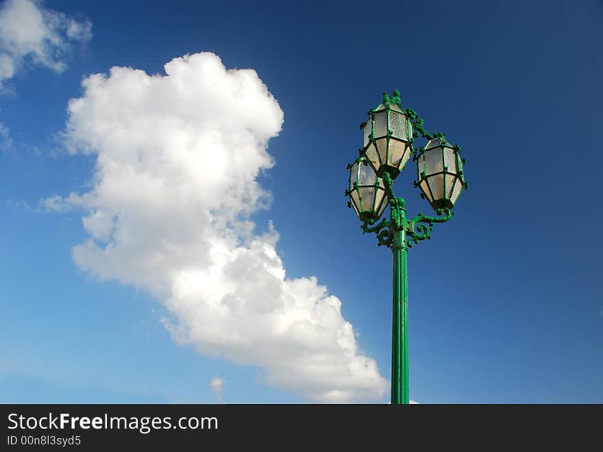 A street lamp against sky.