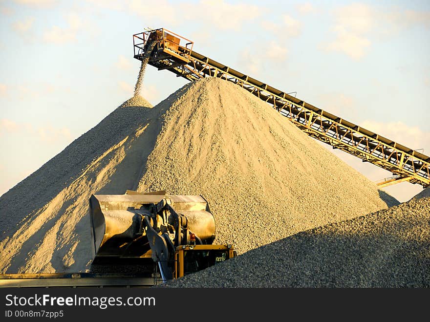 Gravel Operation with heavy equipment and conveyor moving gravel. Gravel Operation with heavy equipment and conveyor moving gravel