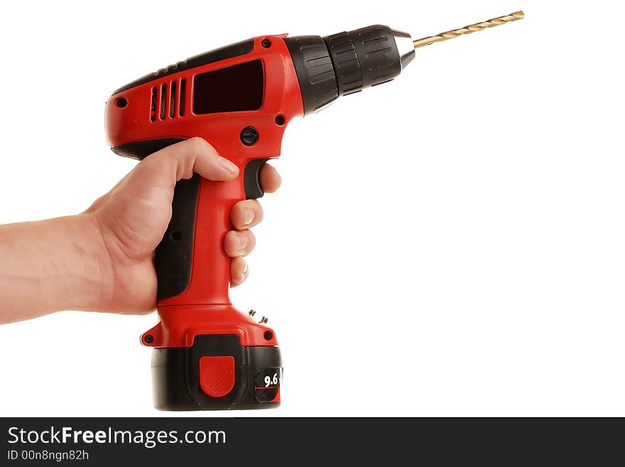 Hand holding a cordless drill isolated against white background