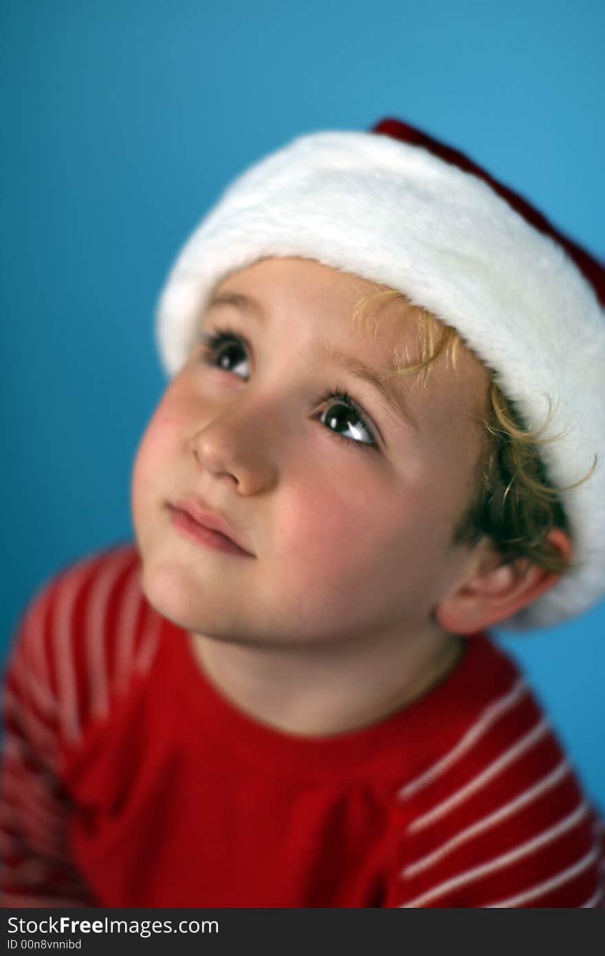 Young Boy In A Santa Hat