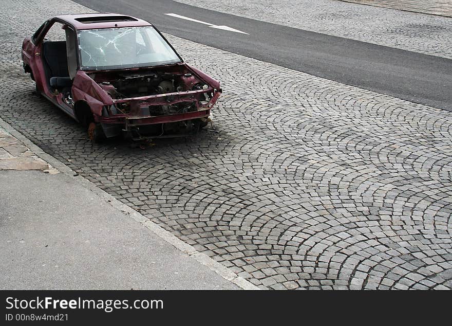 Busted car wreck, found on a parking site near the highway