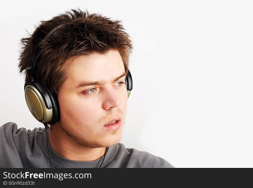 Young Man listening music in headphones