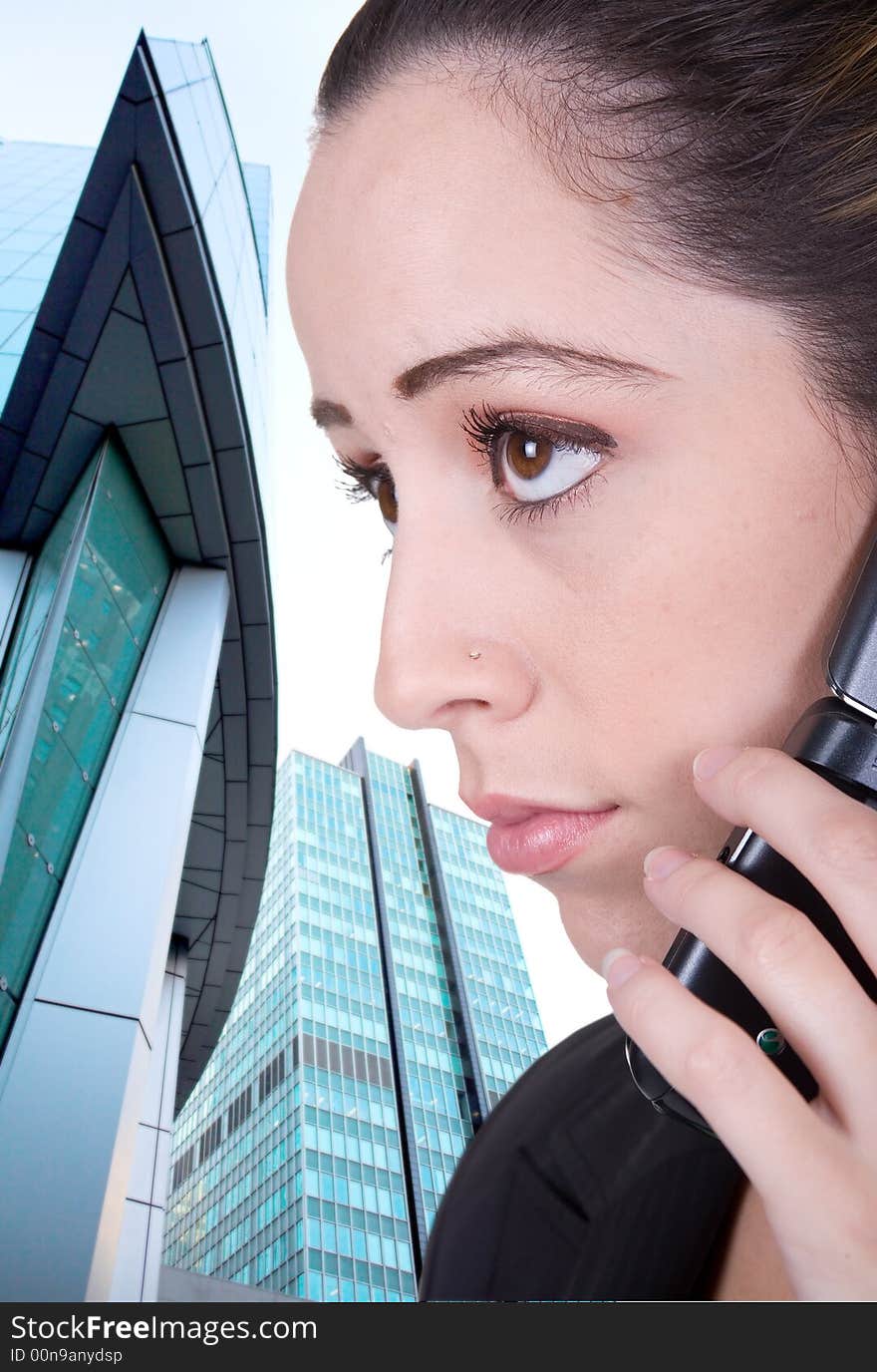 Business woman on the phone over business building