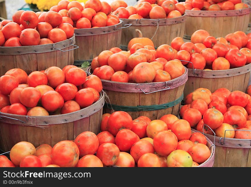 Tomatoes in baskets at a road side farm stand