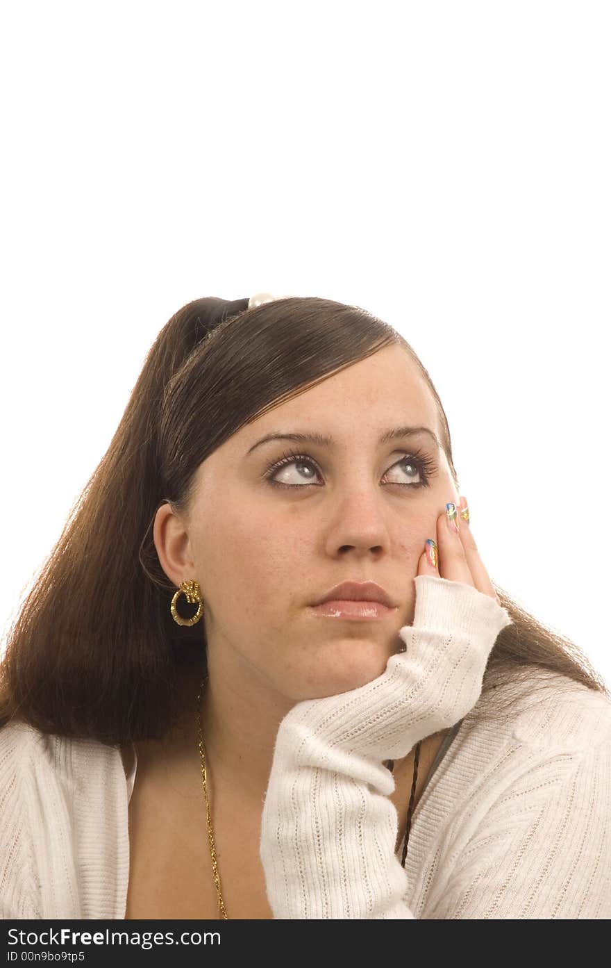 A dreaming teenage girl gazing off into the distance isolated over white