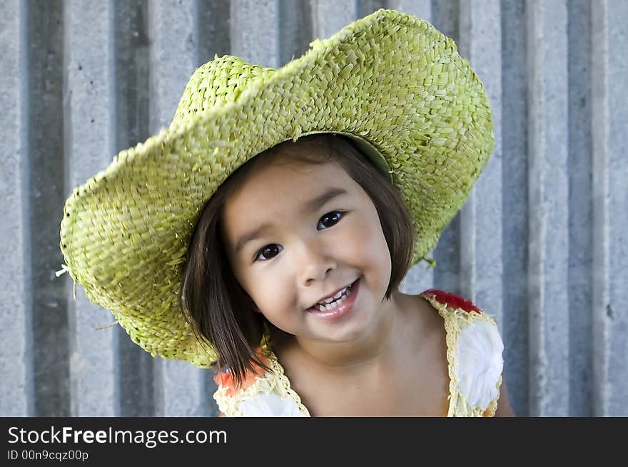 Little girl wearing green hat. Little girl wearing green hat