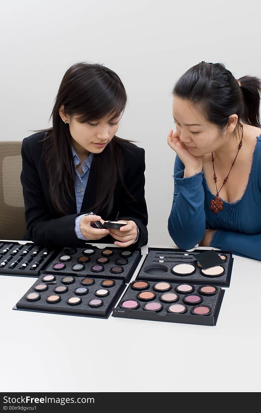 A girl was demonstrating a makeup product sales. A girl was demonstrating a makeup product sales