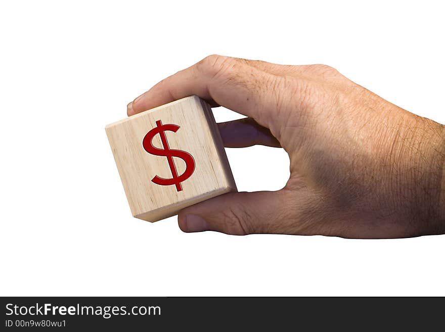 Single hand holding wooden block with dollar sign