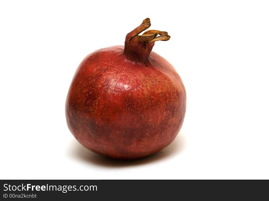 Juicy pomegranate on the white background