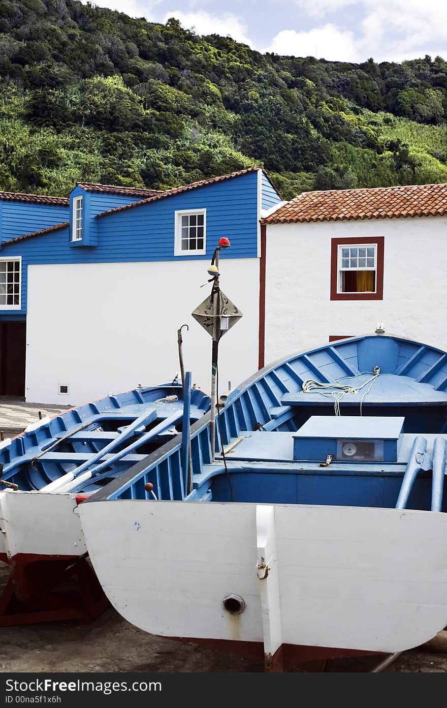 Couple of small fishing rowboats resting