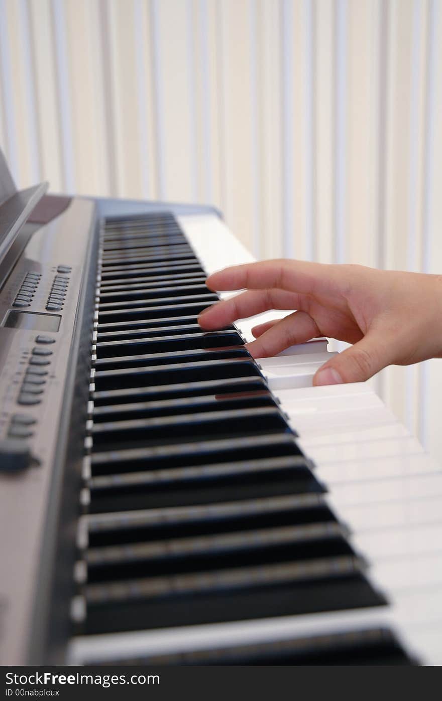 A photo of a hand playing piano