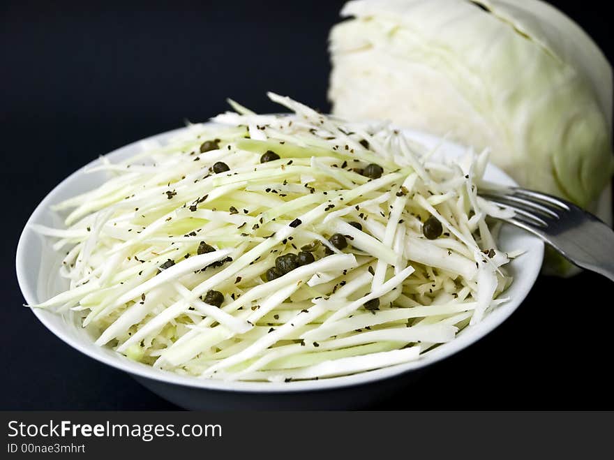 Cole salad with caper and pepper-cutted.