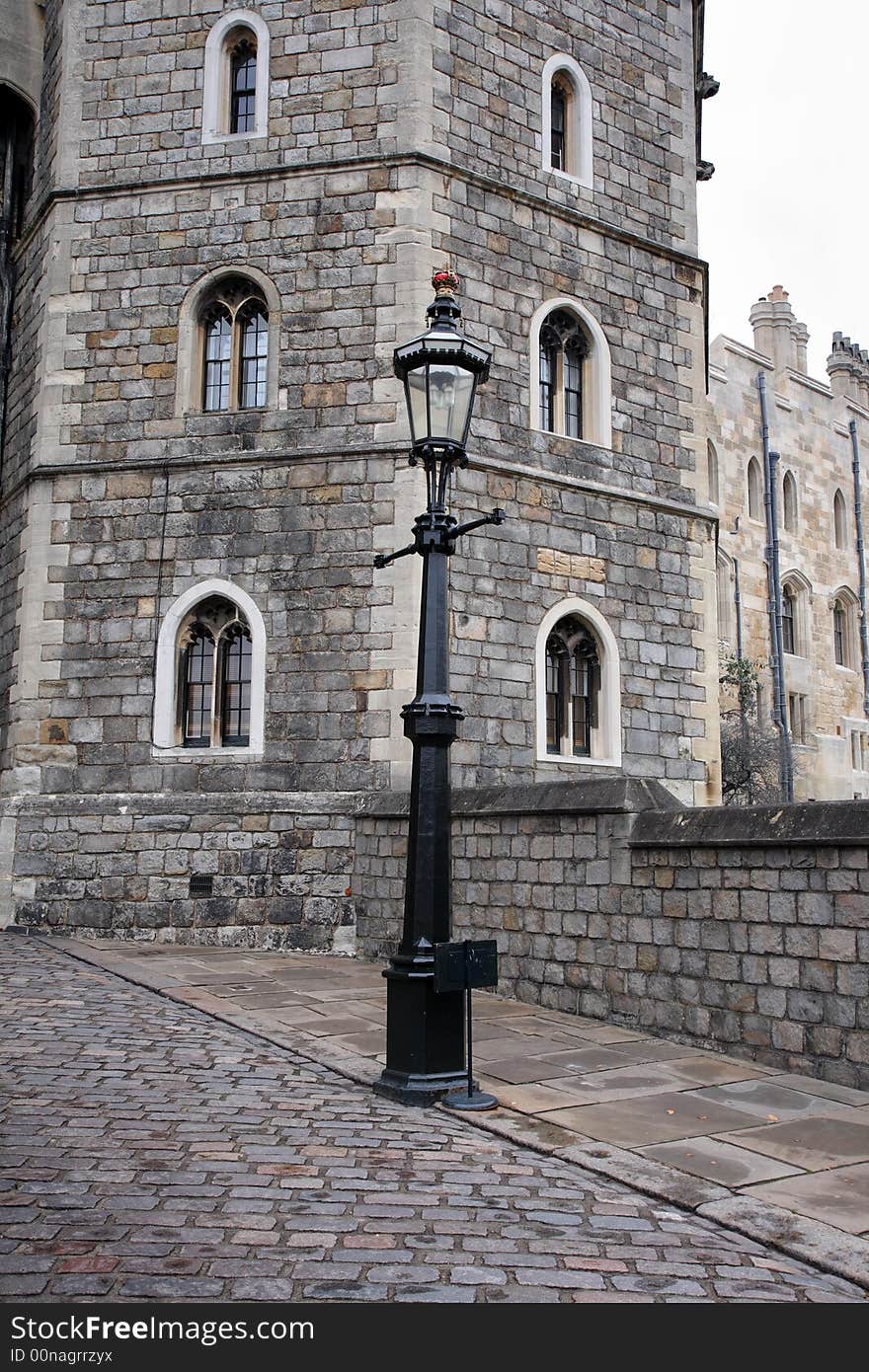 Cobbled Entrance to Windsor Castle in England with a Victorian Street Lamp in the foreground