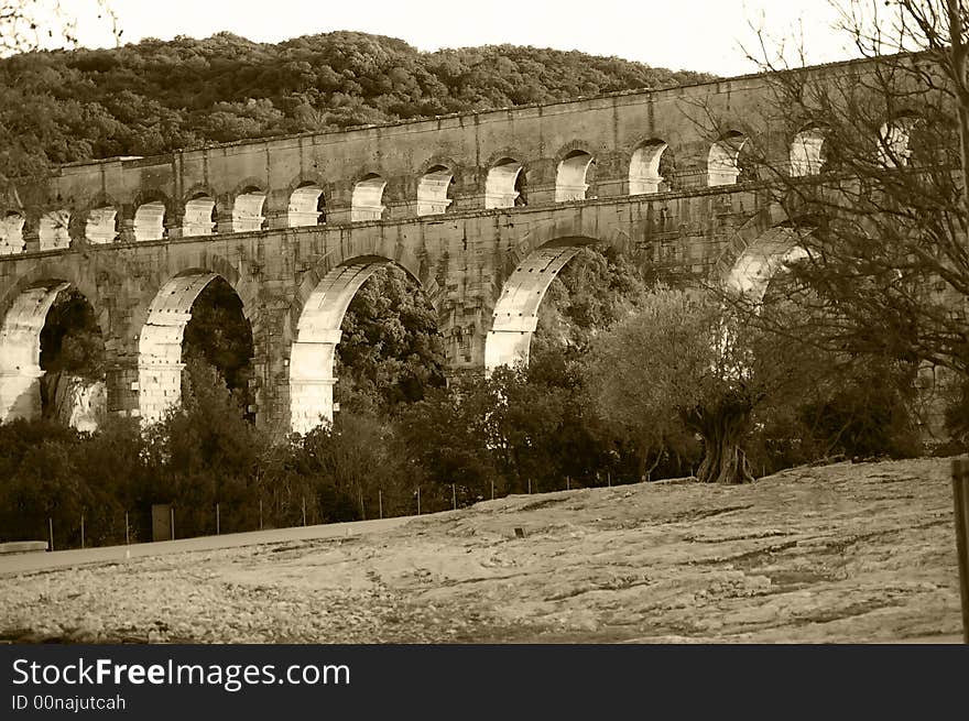 A stone bridge in the south of France at the end of afternoon. A stone bridge in the south of France at the end of afternoon