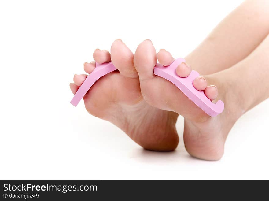 Foot care shot with woman feet over white background. Foot care shot with woman feet over white background