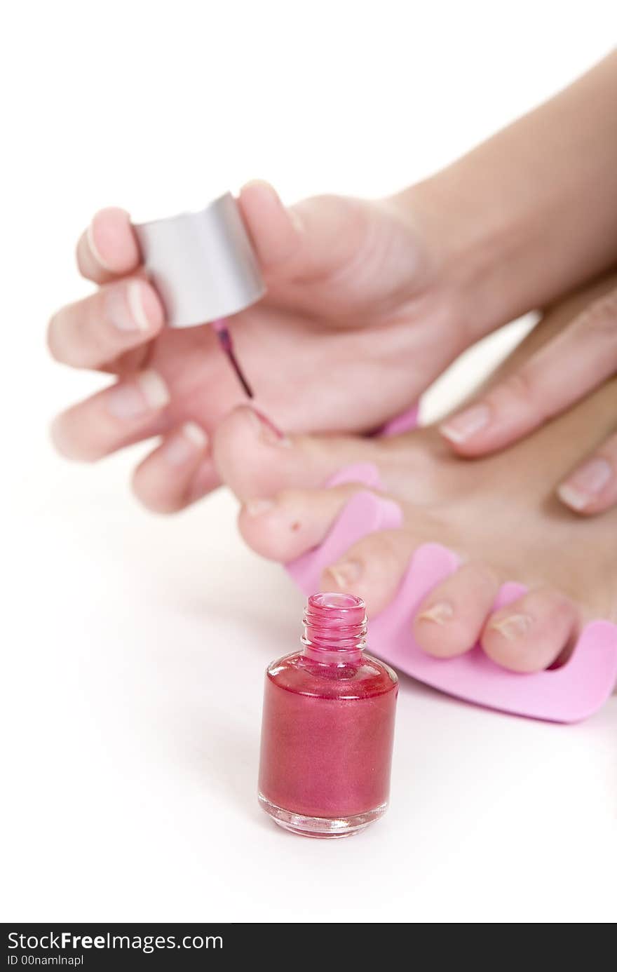 Foot care shot with woman feet over white background. Foot care shot with woman feet over white background