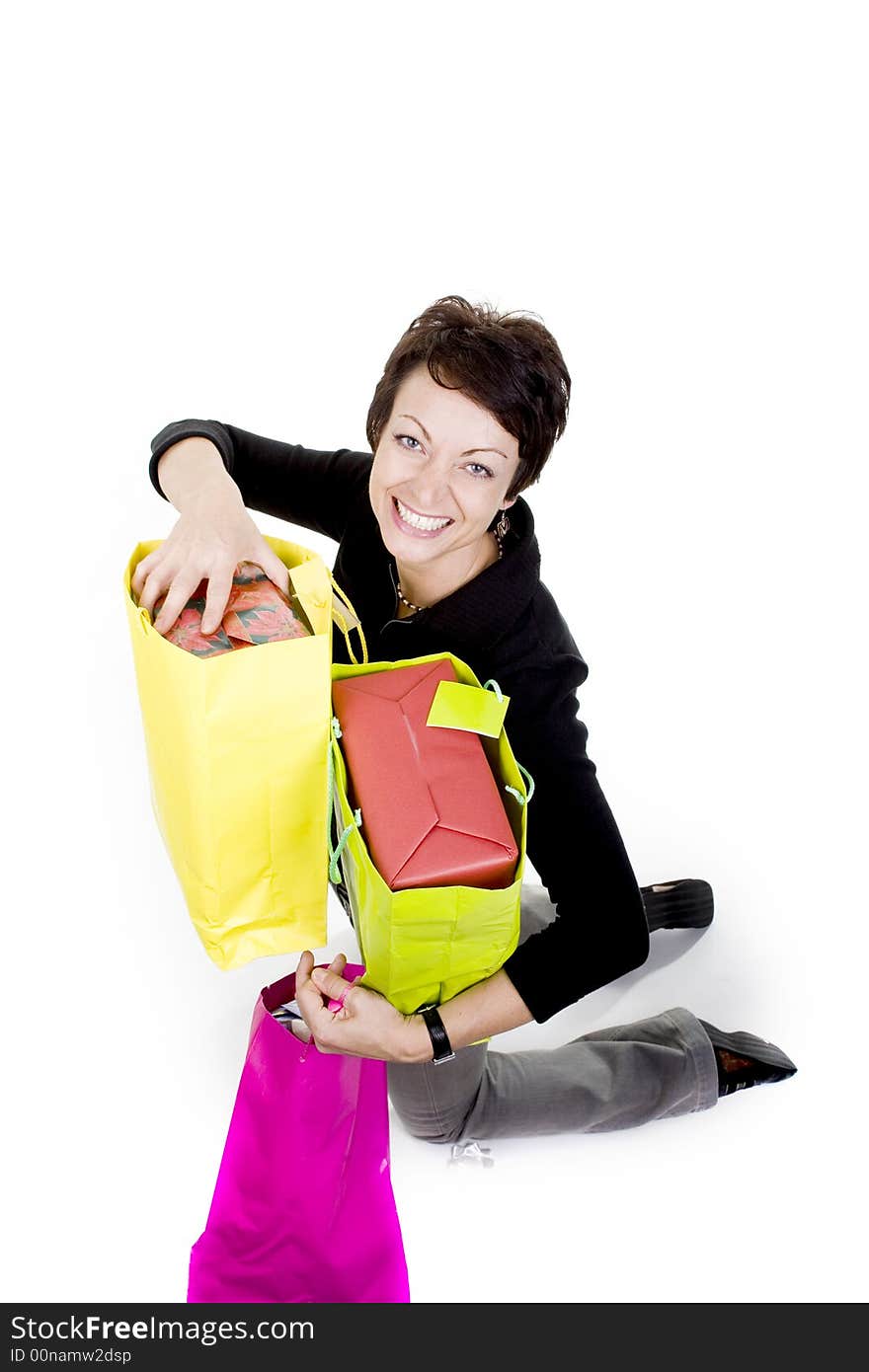 Woman with shopping bags over white background. Woman with shopping bags over white background