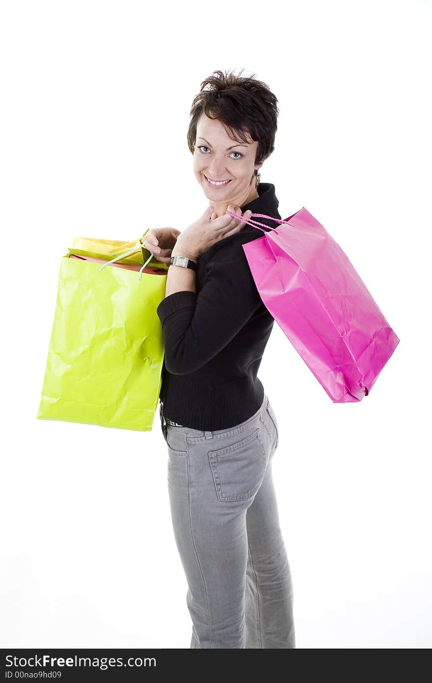 Woman with shopping bags over white background. Woman with shopping bags over white background