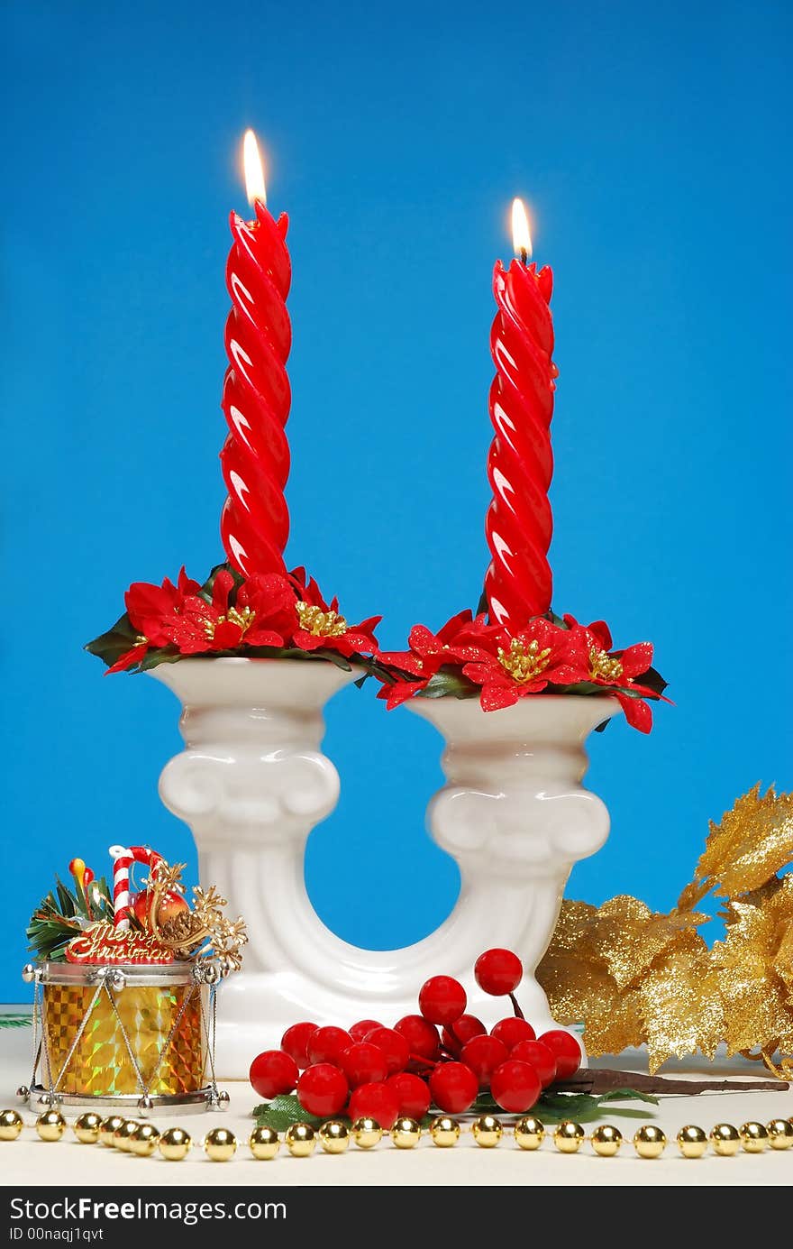 Red candle and christmas decorations