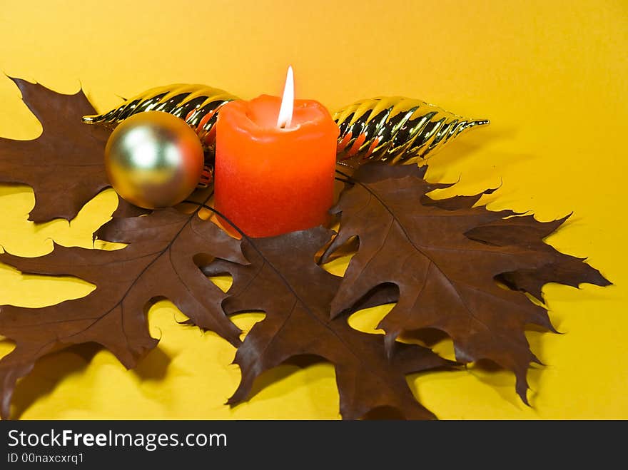 A christmas ornament with candle.