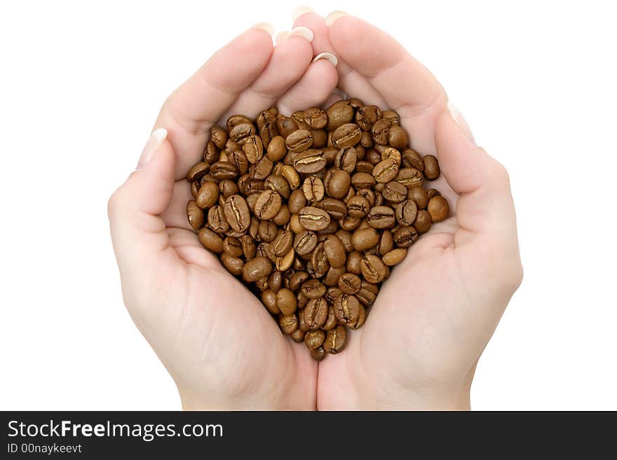 Handful of coffee beans isolated on a white background.