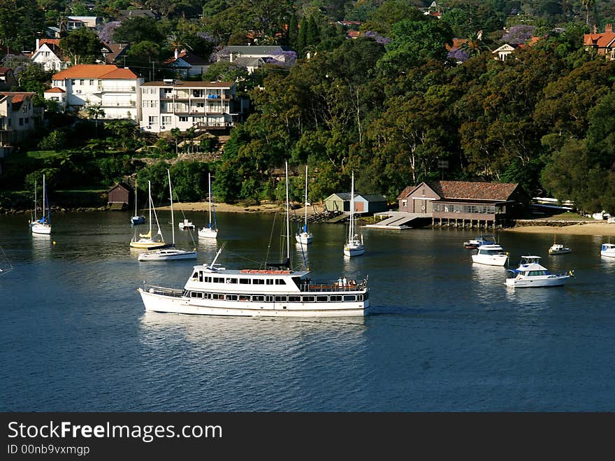 A quiet water way with a cruising launch. A quiet water way with a cruising launch