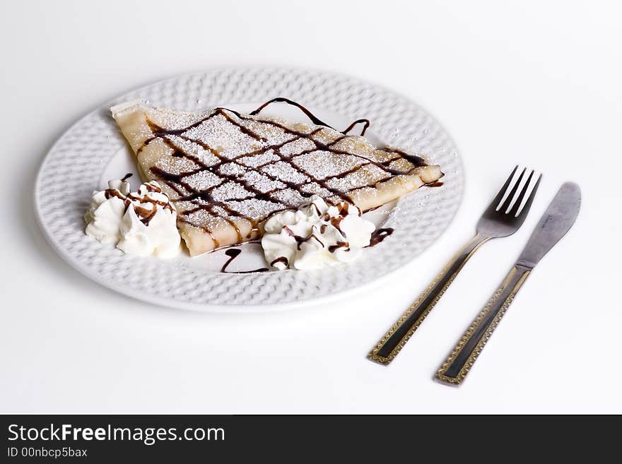 Pancake With Chocolate and cream on plate