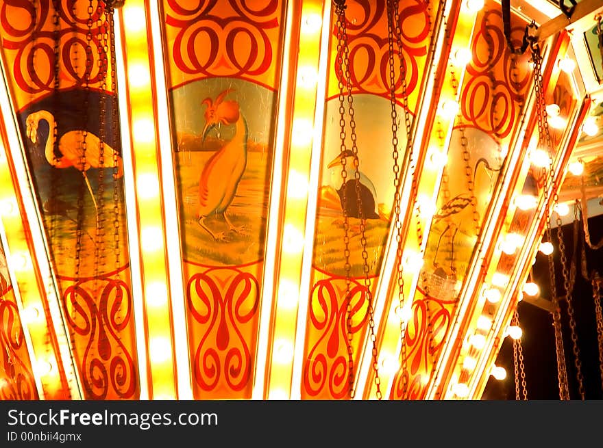 Fast spinning carousel in the black night