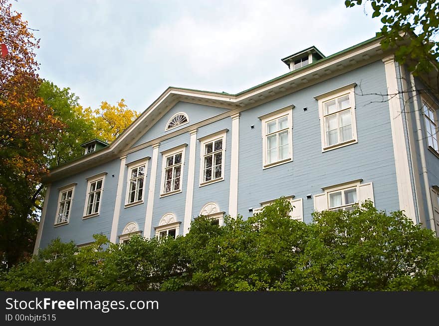 Light blue luxury wooden house in summertime