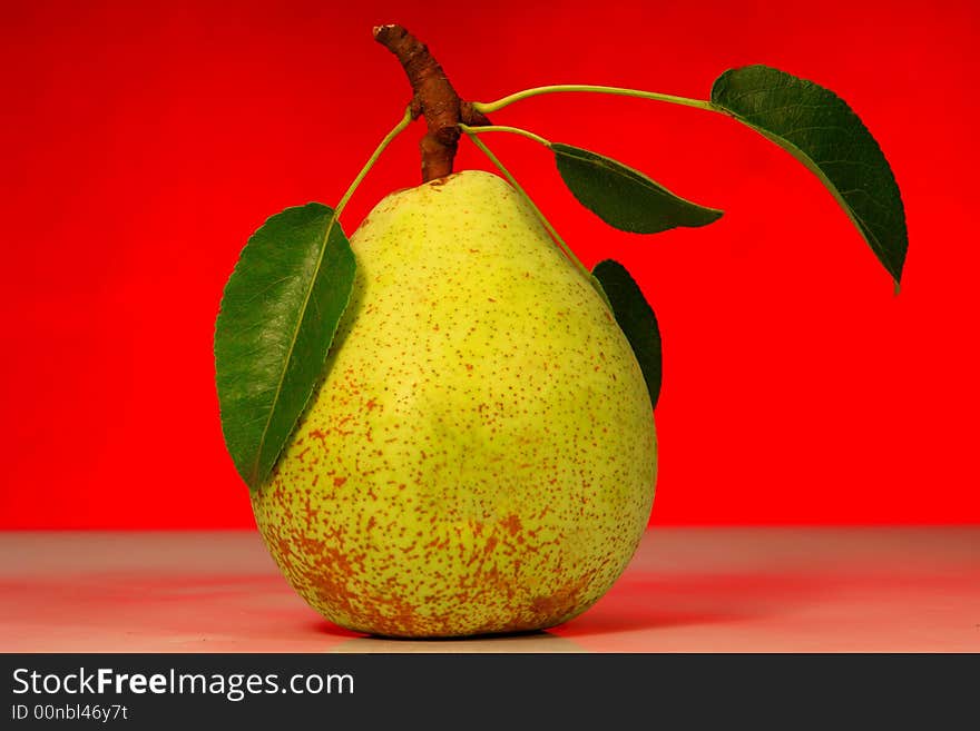 Pear on a red background