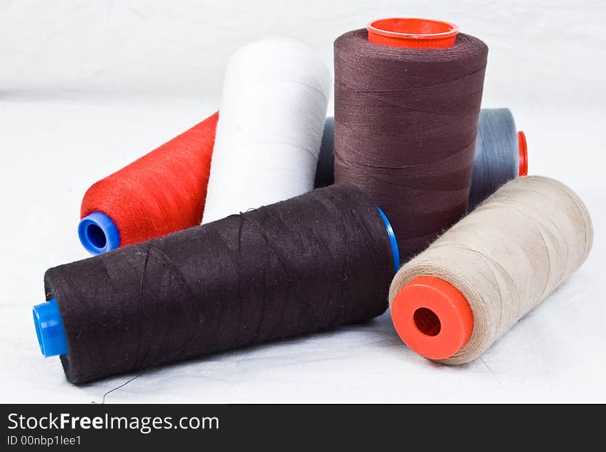 Thread spools on white background