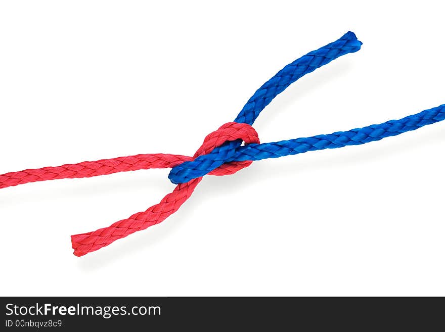 Fisher's granny(bad reef) knot with red and blue ropes. Isolated on white. Tight. Fisher's granny(bad reef) knot with red and blue ropes. Isolated on white. Tight.