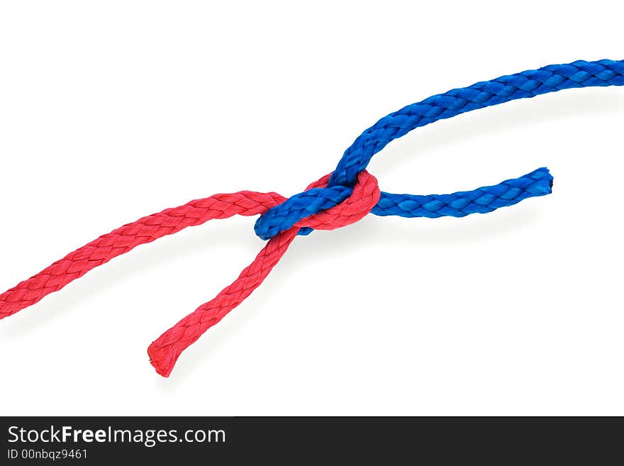 Fisher's bad reef knot with red and blue ropes. Isolated on white. Tight. Fisher's bad reef knot with red and blue ropes. Isolated on white. Tight.