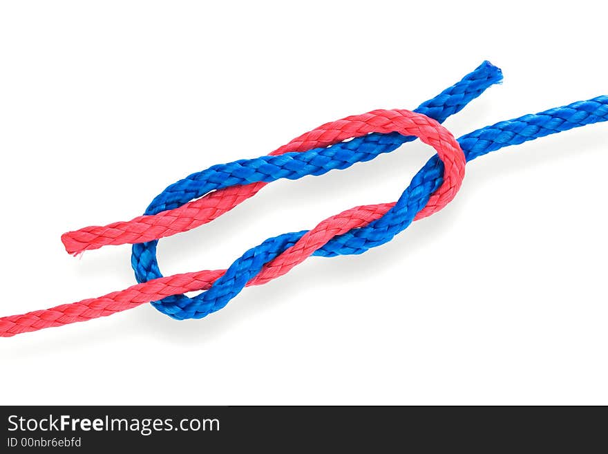 Fisher's surgical knot with red and blue ropes. Isolated on white. Fisher's surgical knot with red and blue ropes. Isolated on white.