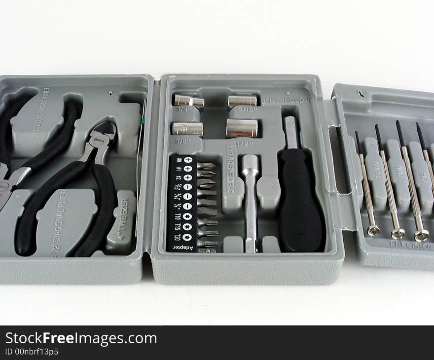 A small tool kit for home repairs against a white background. A small tool kit for home repairs against a white background.