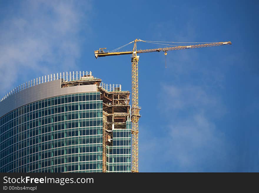 Construction of a skyscraper in Moscow, early morning. Construction of a skyscraper in Moscow, early morning