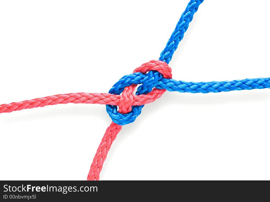 Fisher's plane knot with red and blue ropes. Isolated on white. Tight. Fisher's plane knot with red and blue ropes. Isolated on white. Tight.