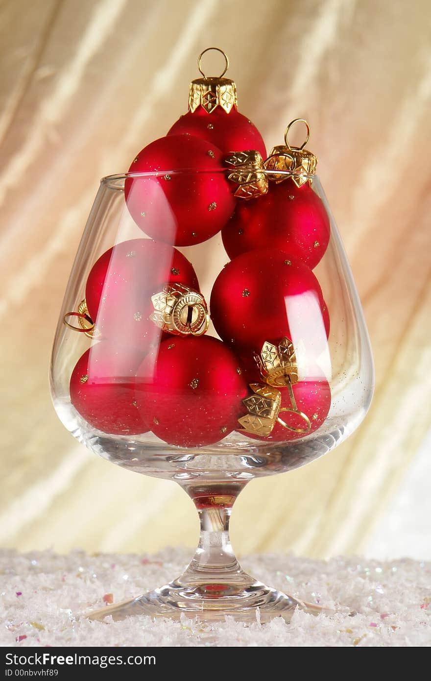 Glass with spheres on a beige background. Glass with spheres on a beige background