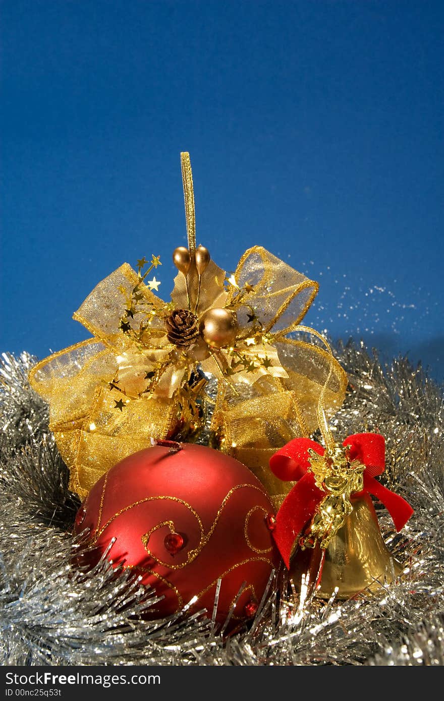 Christmas arrangement with red globe, golden bell and ribbon. Christmas arrangement with red globe, golden bell and ribbon