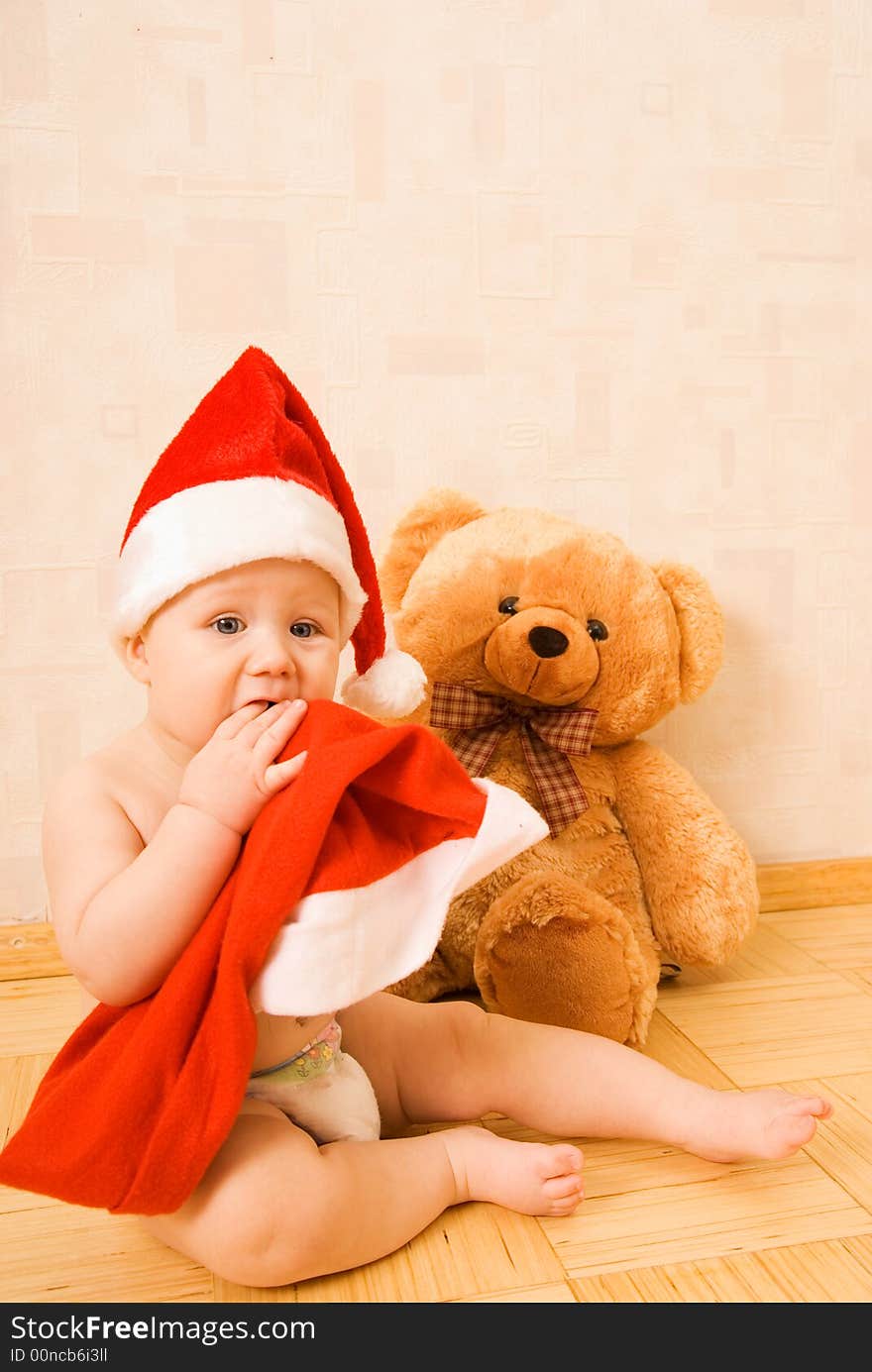 Adorable baby in Christmas hat. Adorable baby in Christmas hat