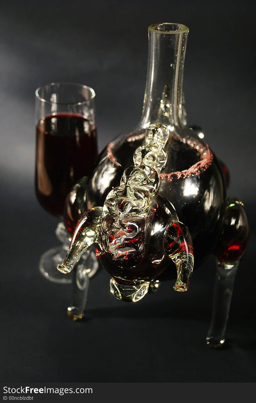 Glass of red wine and bottle - bull.