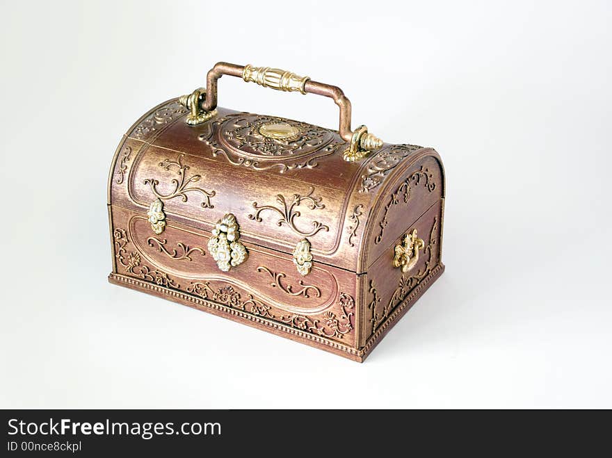 Gilded wooden small box on a blue background