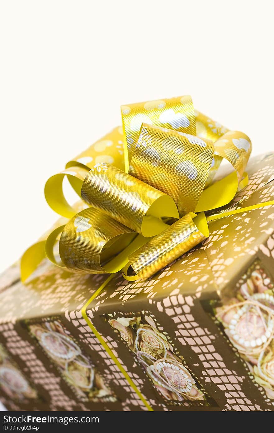 Detail Of A Gift Box With Golden Ribbon And Bow