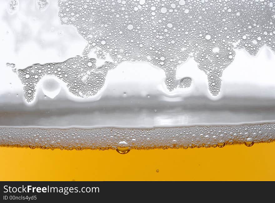 Beer in glass on the white background. Beer in glass on the white background