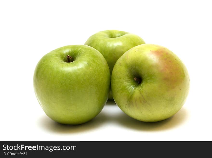 Green apples on the white background