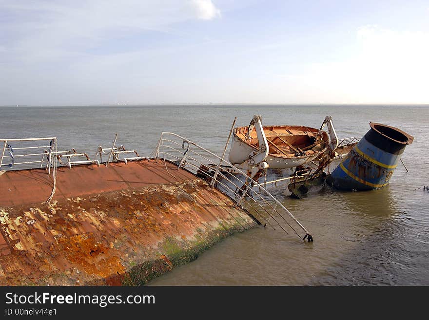 Rusted shipwreck abandoned in the coast. Rusted shipwreck abandoned in the coast