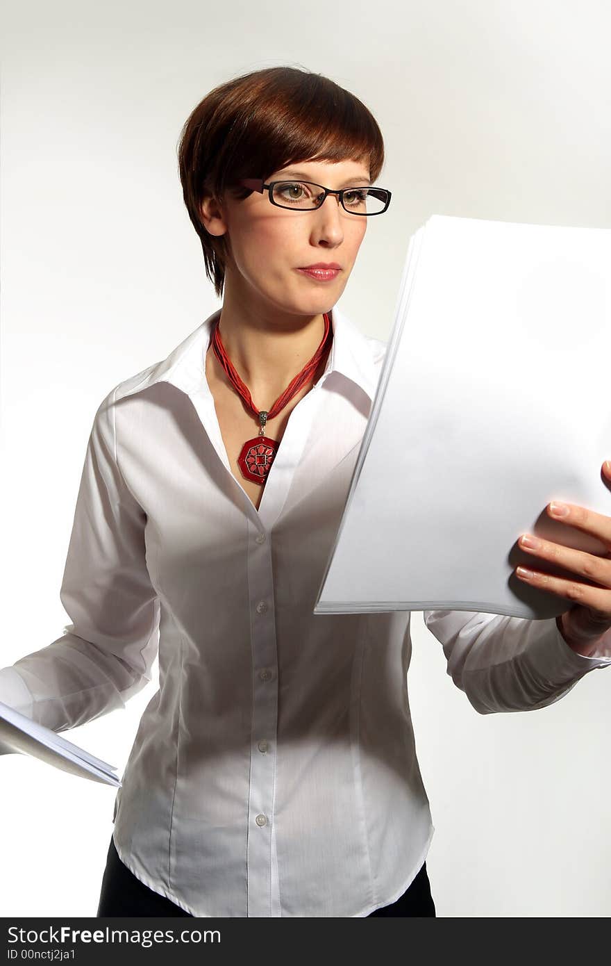 Confident young business woman on white background